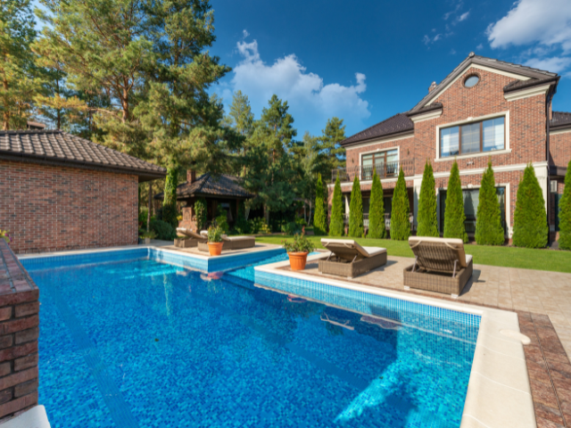 Pool construction excavation process completed in Texas backyard